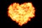 Heart filled made by burning flames on black background with fire particles, valentine day and love