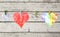 Heart with flowers on a rope with clothespin