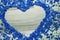 Heart frame of blue confetti - copy space