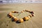 Heart full of shells on the sandy beach of Cyprus, coastline of the Mediterranean
