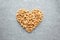 Heart from granola on parchment paper, top view. Muesli, concept healthy breakfast