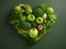 Heart of green fruits and vegetables isolated on green background. Green life concept and healthy eating lifestyle. Shape of heart