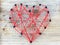 Heart handcrafted with nails and red line