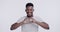 Heart, hands and face of black man on a white background for love, kindess and support in studio. Emoji, happy and