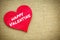 Heart with happy valentine word isolated on a burlap fabric. Valentines Day and love concept