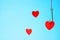 Heart on a hook on a blue background. Concept of love. Valentine`s day. Love choice