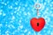 Heart with a keyhole and skeleton key on blue