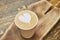 Heart latte art, paper cup.