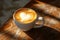 heart latte on wood background