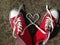 Heart Love shape symbol with sneakers teen baseball urban `teen love` or healthy heart exercise concept red boots with laces heart