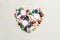 Heart made of assorted multi-colored pills