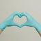 Heart made of blue medical gloves. Healthy lifestyle, medical store, pharmacy, ambulance and medicine concept