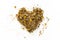 Heart made of dried chamomile tea, on white background