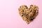 Heart made of healthy granola bars and ingredients on background, flat lay. Space for text