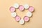 Heart made of scented candles on beige background