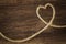 Heart made from string on natural background