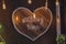 Heart made of wooden planks and electric lamps retro