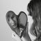 Heart mirror reflecting face of girl monochrome image