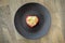 Heart muffin on brown plate. Lovely morning breakfast. Romantic love symbol