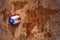 Heart with national flag of puerto rico on a vintage world map crack paper background.