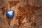 Heart with national flag of somalia on a vintage world map crack paper background.