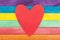 Heart note on colorful wooden background