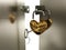 Heart-padlock with key on the gate