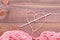 Heart of pink yarn, tangle of thread and needle