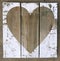 Heart on a plank wall, whitewashed, scratched, shabby