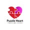 Heart puzzle logo template design vector in isolated background. Autism awareness concept logo for charitable organization,