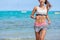 Heart rate monitor runner woman running on beach
