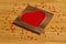 Heart from red beads in wooden heart-shaped box