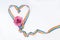 Heart from a ribbon with multi-colored lines and a rose. Color palette symbols of the LGBT.Sample congratulations of