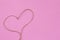 Heart rope on pink background