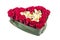 Heart of roses and orchids Cymbidium on a white background