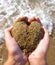 Heart of sand in hands