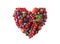 Heart shape assorted berry fruits on white background. Berries in heart shape isolated on a white. Ripe blueberries, red currants,