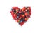 Heart shape assorted berry fruits on white background. Black-blue and red food. Ripe blueberries, red currants, raspberries, straw