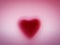 Heart shape behind milky frosted glass. Love, romantic background