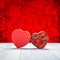 Heart shape box with red roses inside on white wood table top at blur red sparkle bokeh light background,Love concept,greeting