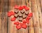 Heart shape chocolate with red hearts, Valentines Day sweets, wood background