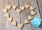 Heart shape cookies with blue gift box on a wooden table for Val