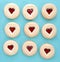 Heart shape cookies filled with raspberry sauce