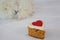 Heart shape easter gingerbread cookie on white table