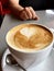 Heart shape foam froth in cup of coffee