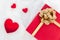 Heart shape with Gift box packed for honeymoon lover on white bed honeymoon suit.Valentine`s day concept. Beautiful blurry