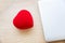 Heart shape with Gift box packed for honeymoon lover on white bed honeymoon suit.Valentine`s day concept. Beautiful blurry