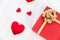 Heart shape with Gift box packed for honeymoon lover on white bed honeymoon suit.Valentine`s day concept. Beautiful blurry