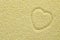 Heart shape graven upon couscous groats background. Heart contour on couscous as Valentine`s Day Concept