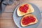 Heart shape jam on toasted bread